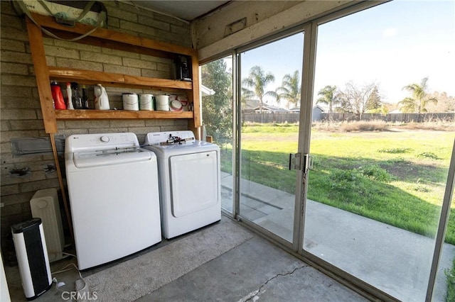 laundry area with washing machine and clothes dryer