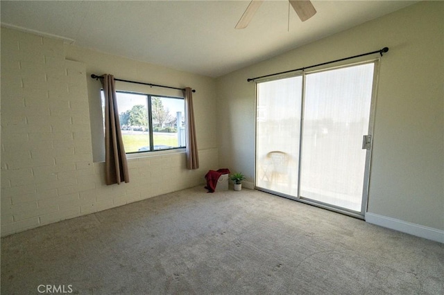 empty room with light carpet, vaulted ceiling, and ceiling fan