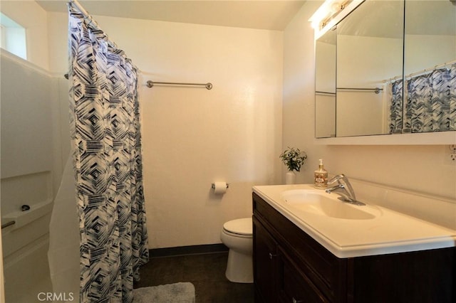 bathroom featuring vanity, a shower with curtain, and toilet