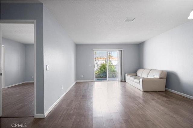 3738 Harrison St Unit 31, Riverside, CA 92503 - unfurnished room featuring wood finished floors, visible vents, and baseboards