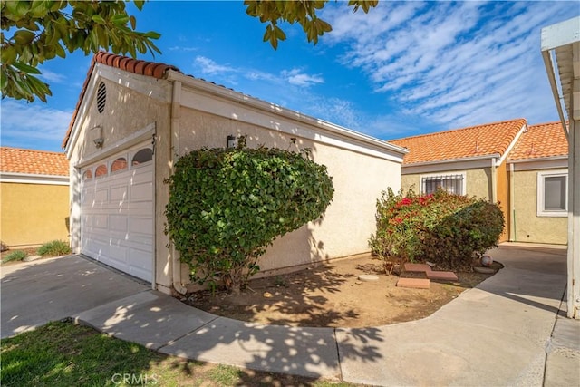 3738 Harrison St Unit 31, Riverside, CA 92503 - view of front of home featuring a tiled roof and stucco siding