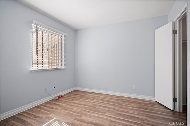 3738 Harrison St Unit 31, Riverside, CA 92503 - unfurnished bedroom with wood finished floors and baseboards