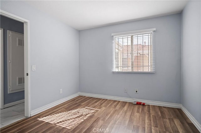 3738 Harrison St Unit 31, Riverside, CA 92503 - unfurnished room featuring visible vents, baseboards, and wood finished floors