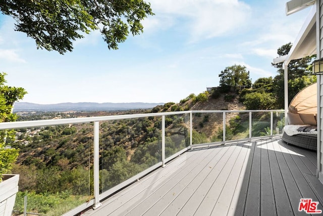 wooden terrace with a mountain view