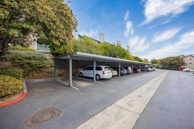 view of vehicle parking featuring a carport