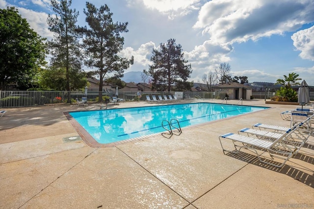 view of swimming pool with a patio