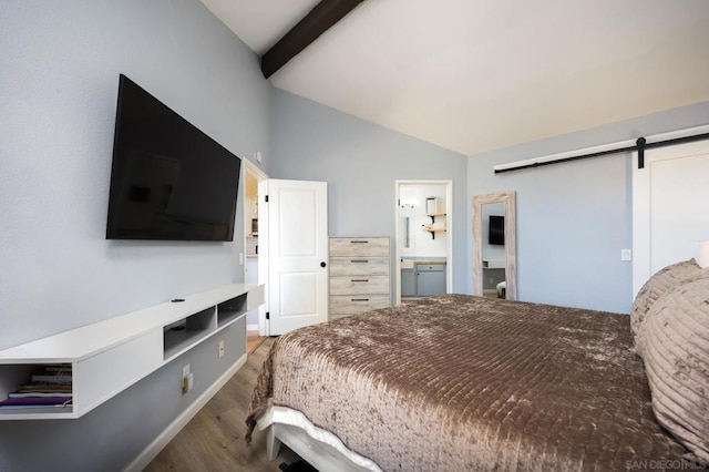 bedroom featuring ensuite bath, a barn door, hardwood / wood-style floors, and vaulted ceiling with beams