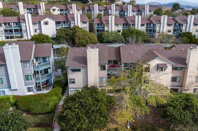 birds eye view of property featuring a mountain view