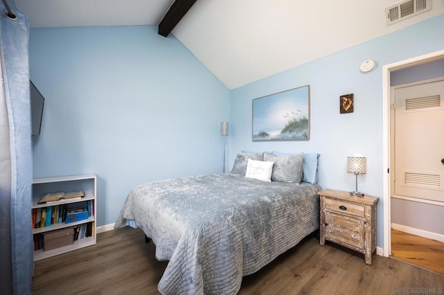 bedroom featuring dark wood-type flooring and lofted ceiling with beams