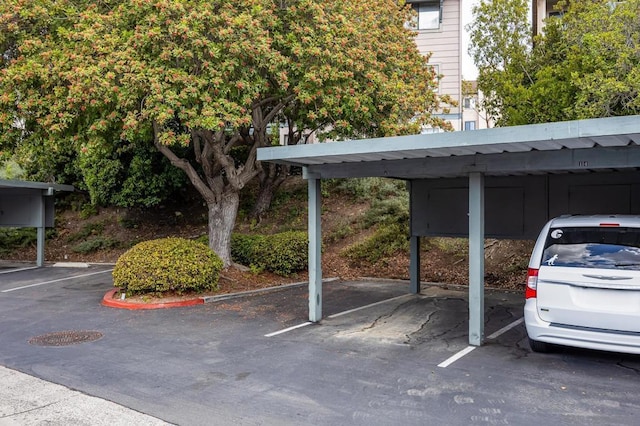 view of parking / parking lot featuring a carport