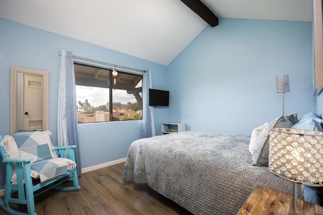 bedroom with dark wood-type flooring and lofted ceiling with beams