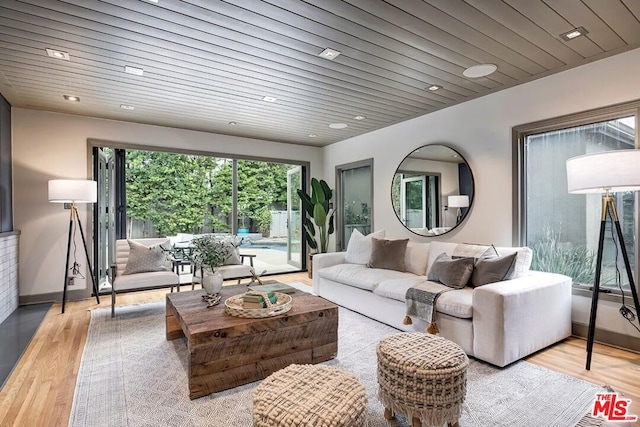 living room with wooden ceiling and light hardwood / wood-style floors