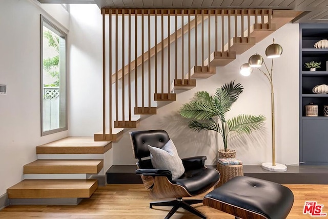 stairway featuring hardwood / wood-style floors