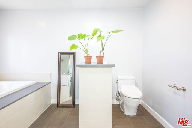 bathroom featuring tile patterned flooring and toilet