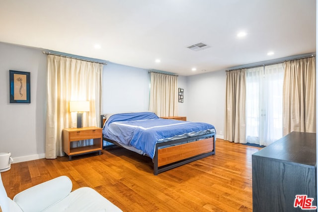 bedroom with wood-type flooring