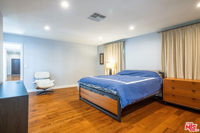 bedroom featuring hardwood / wood-style flooring