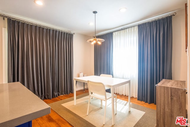 dining area with hardwood / wood-style flooring