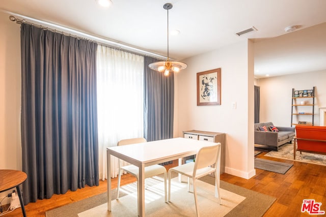 dining area featuring wood-type flooring