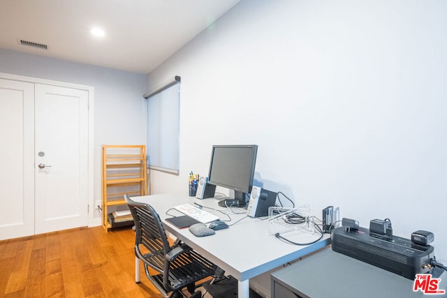 home office featuring light hardwood / wood-style floors