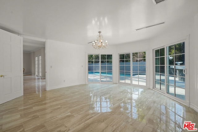 empty room with a notable chandelier