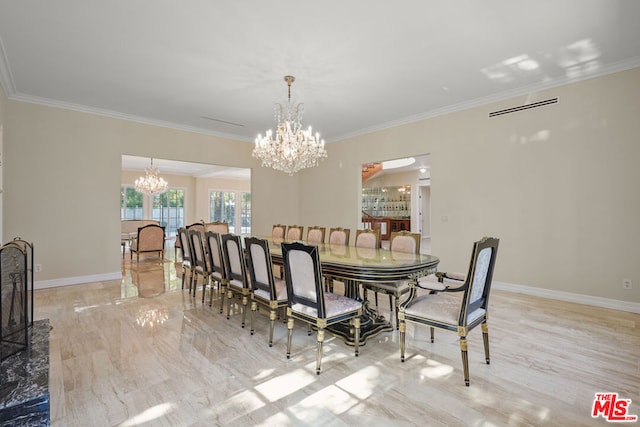 dining room featuring ornamental molding and a notable chandelier