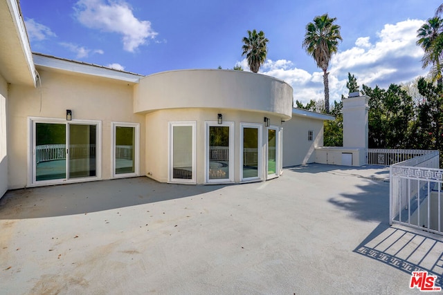 rear view of house with a patio