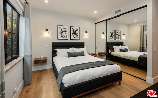 bedroom with wood-type flooring