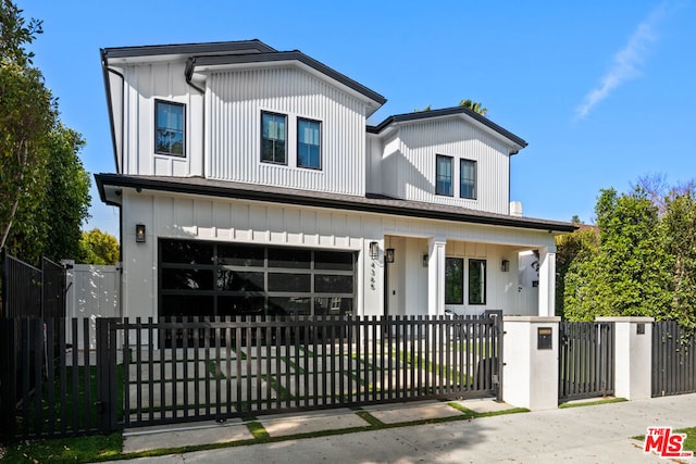 view of front facade featuring a garage and covered porch