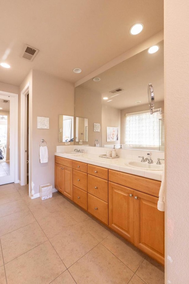 bathroom with vanity and tile patterned flooring