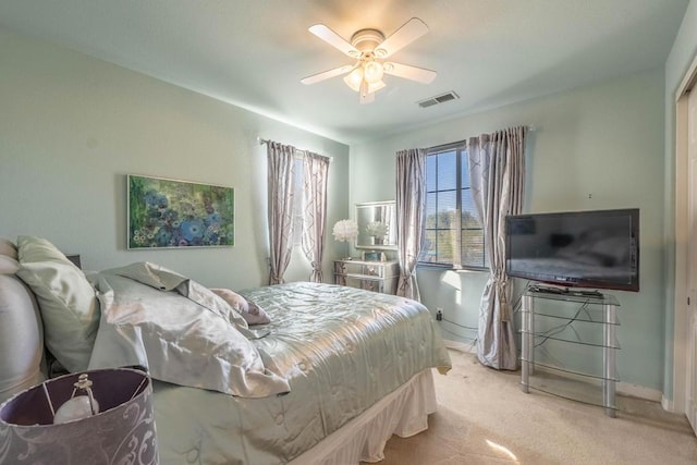 carpeted bedroom with ceiling fan