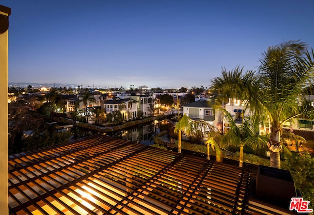 view of balcony at dusk