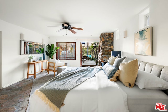 bedroom featuring ceiling fan and access to outside