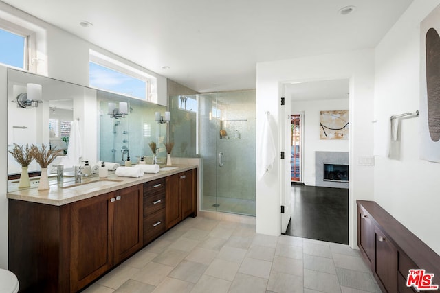 bathroom with vanity and an enclosed shower