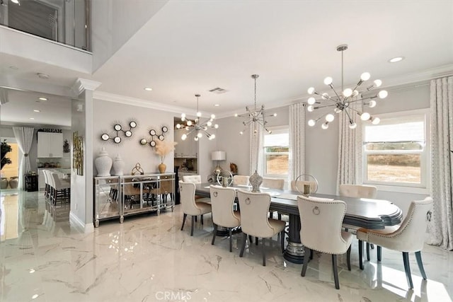 dining room with marble finish floor, ornamental molding, visible vents, and a notable chandelier