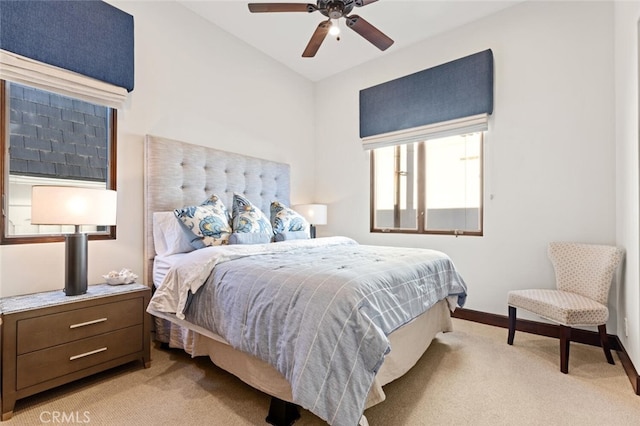 bedroom featuring ceiling fan and light carpet