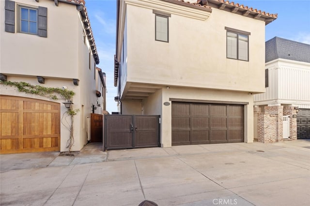 mediterranean / spanish-style home with a garage