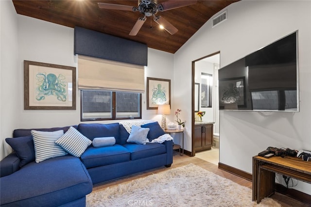 living room featuring lofted ceiling, wooden ceiling, and ceiling fan