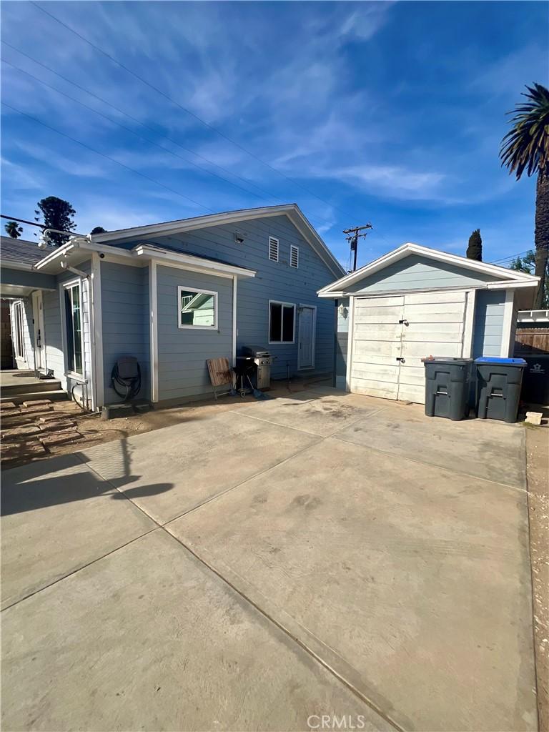 exterior space featuring an outbuilding and a garage