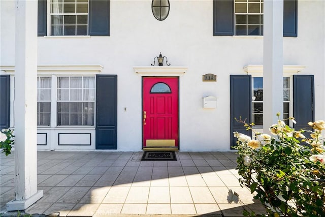 entrance to property featuring a patio area