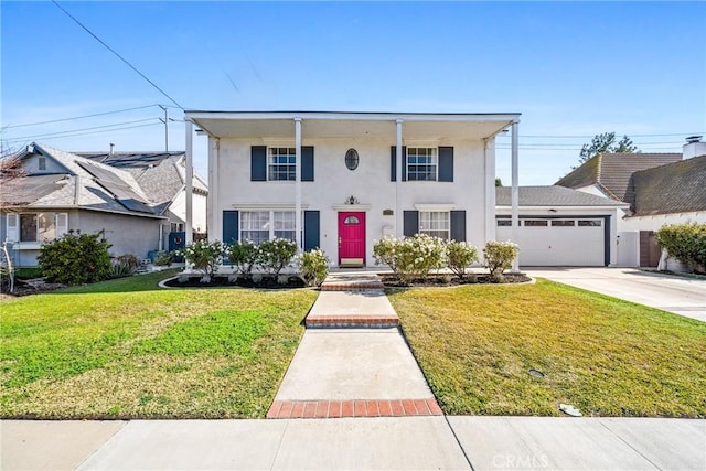 view of front facade featuring a garage and a front lawn