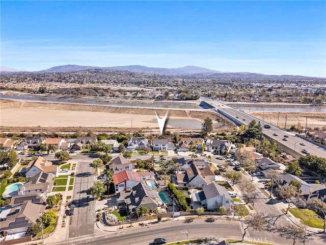 bird's eye view with a water and mountain view