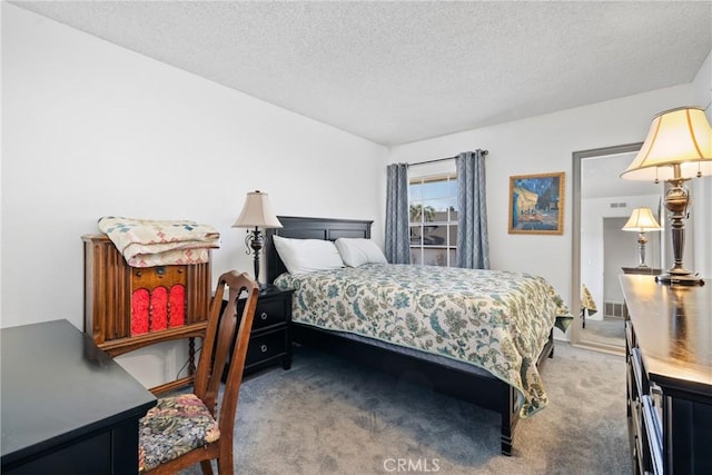 carpeted bedroom with a textured ceiling