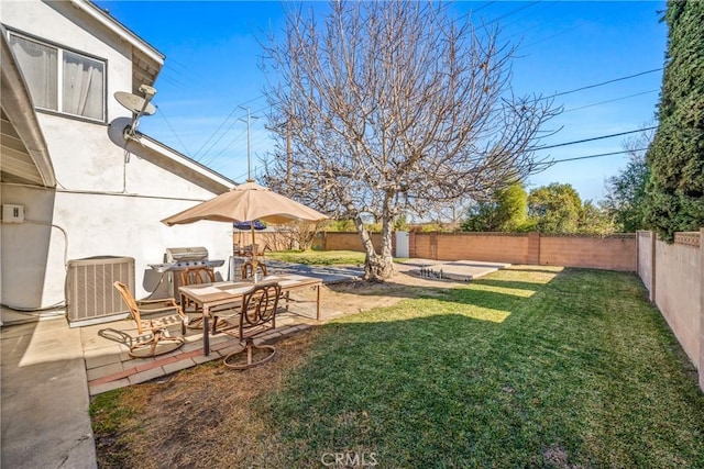 view of yard with a patio area and central air condition unit