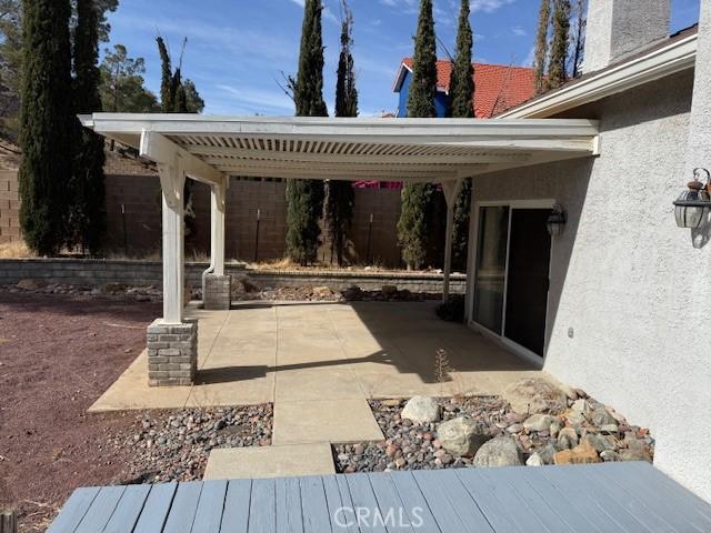 view of patio / terrace with a carport