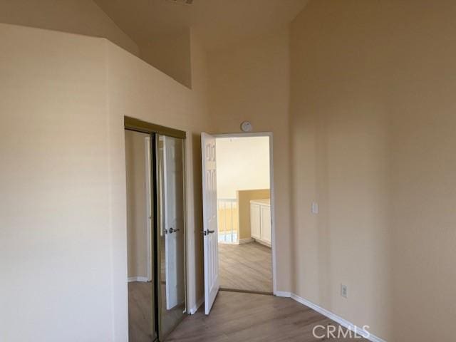 hall with light hardwood / wood-style flooring