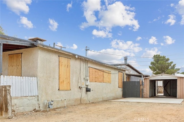 view of property exterior featuring a patio