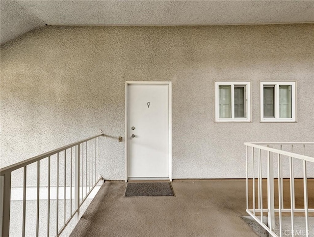 entrance to property featuring a balcony