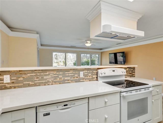 kitchen with white appliances, ceiling fan, white cabinetry, backsplash, and ornamental molding