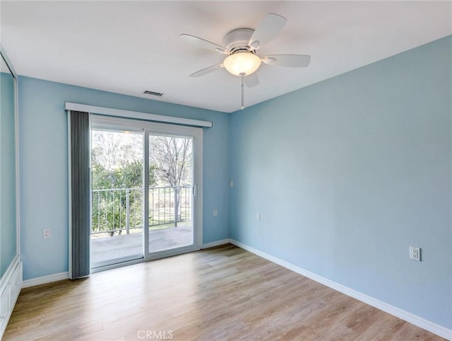 unfurnished room featuring ceiling fan and light hardwood / wood-style flooring