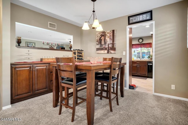 carpeted dining area with bar